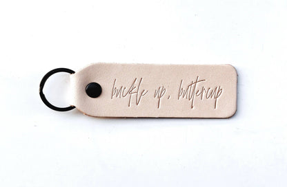 "Buckle Up Buttercup" Script Keychain